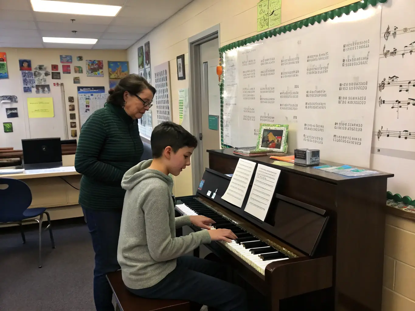 A young adult volunteer smiling while assisting a child in a musical activity during a HIGHNOON event, highlighting the personal enrichment and skill development opportunities.